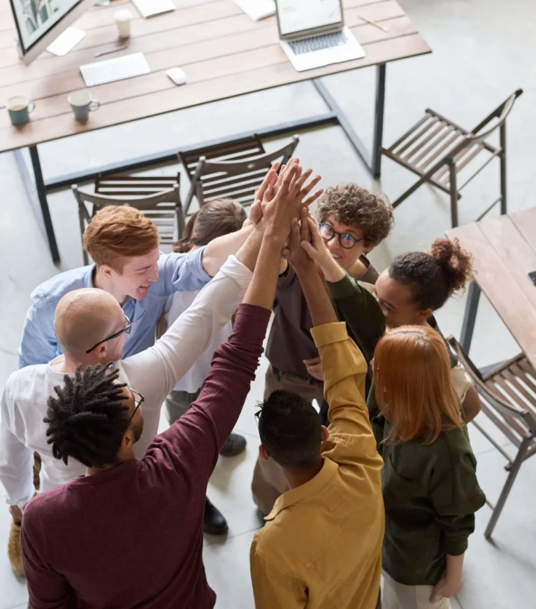 A team of coworkers in huddle formation